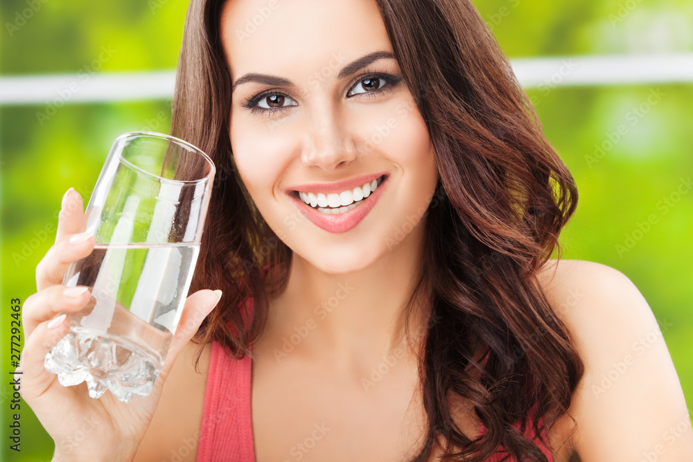 young happy attractive woman with glass of water young happy attractive woman with glass of water