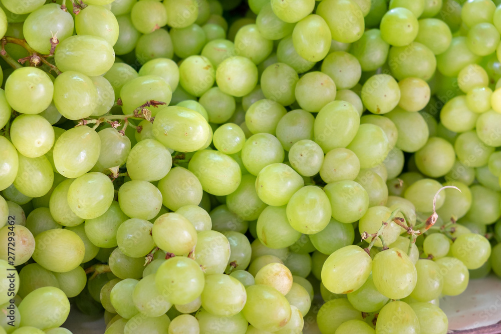 Ripe green-yellow grapes for sale at city farmers market Ripe green-yellow grapes for sale at city farmers market