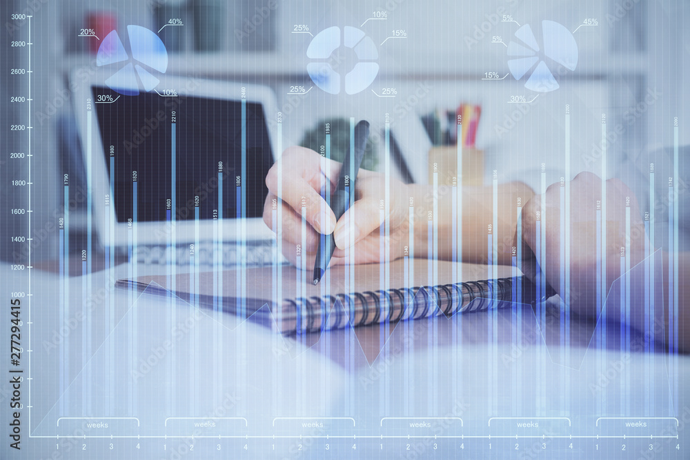 Financial graph displayed on woman's hand taking notes background. Concept of research. Double exposure Financial graph displayed on woman's hand taking notes background. Concept of research. Double exposure