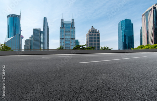 Empty Asphalt Road Through Modern City of Shanghai, China..