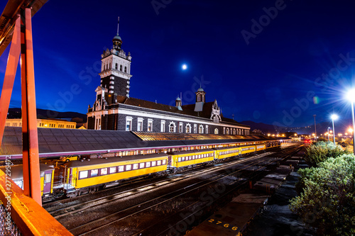 Twilight scenery with clearly sky and moon at Dunedin Train Station in South Island, New Zealand.