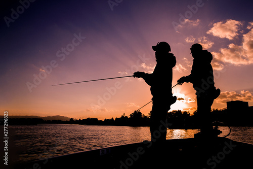 Angler on the boat in the lake
