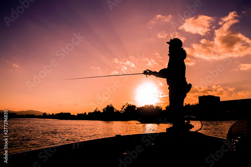 Angler on the boat in the lake