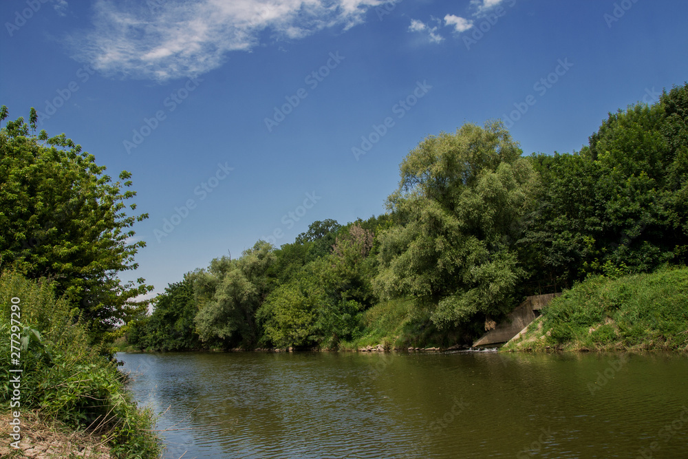 A Beautiful Landscape of the forest/park and the river with a nice sky reflection, on Sunny Day, Nove Zamky, Berek, Slovakia. Europe.