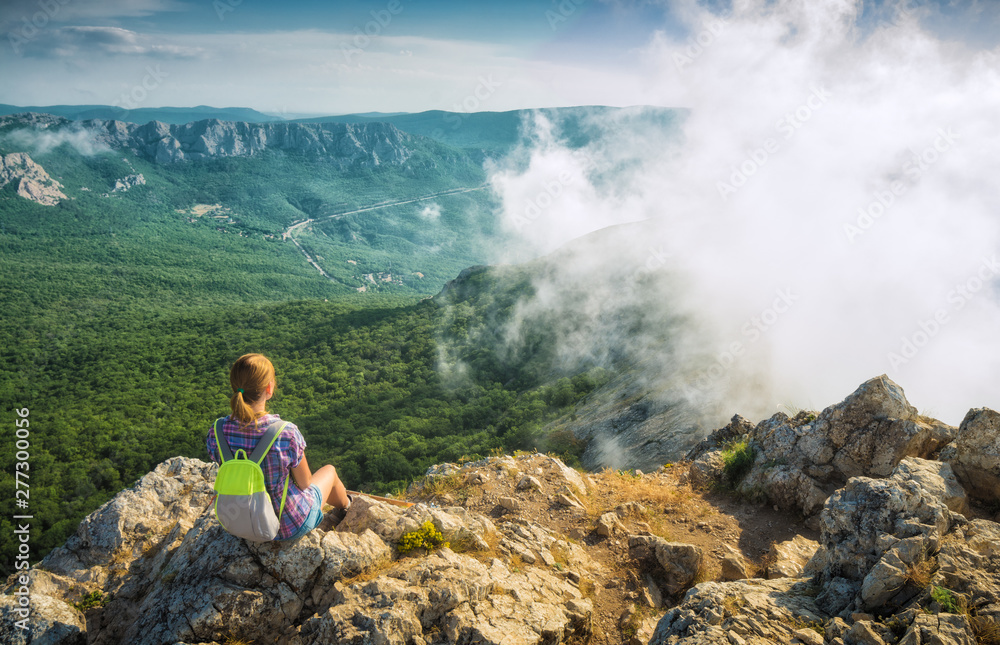 Girl hiker enjoy the foggy mountains Girl hiker enjoy the foggy mountains