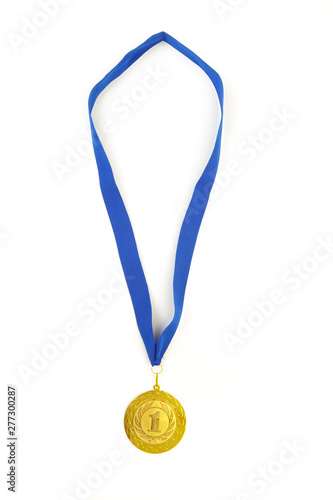 Gold medal in the foreground on  blue ribbon