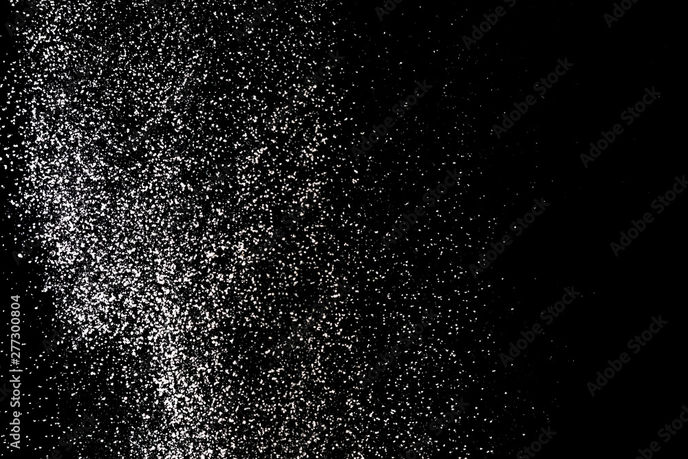 Flour sifting on a black background. White powder splash isolated on black background. Explosive powder white Flour sifting on a black background. White powder splash isolated on black background. Explosive powder white