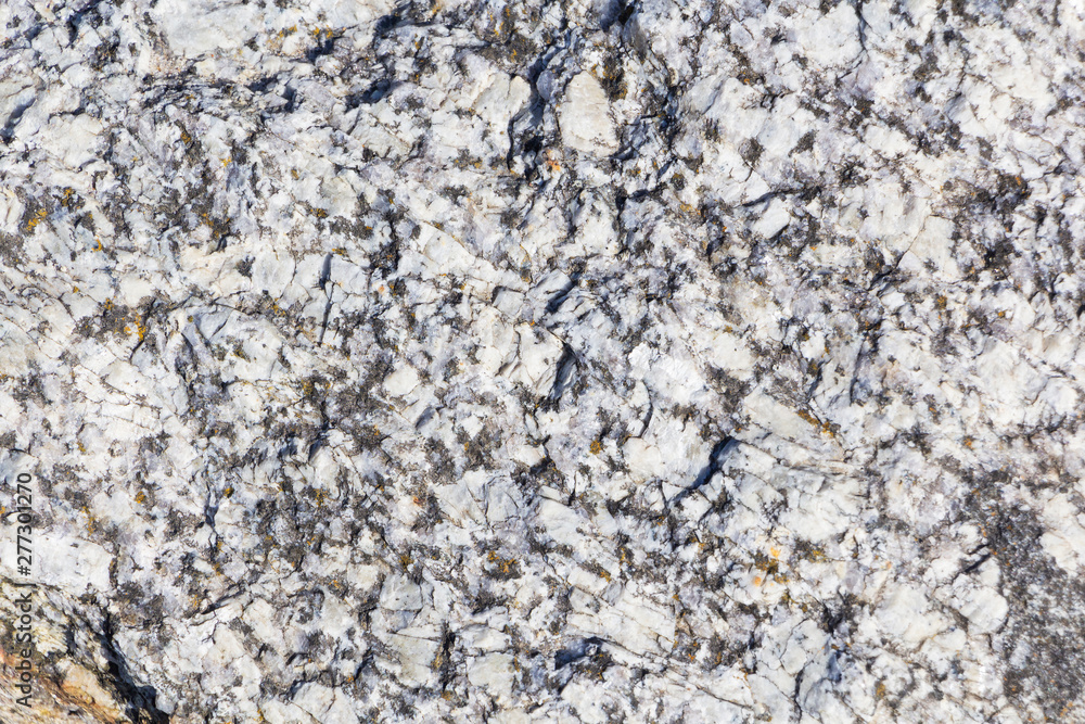 the texture of natural granite. natural stone. close up. the texture of natural granite. natural stone. close up.