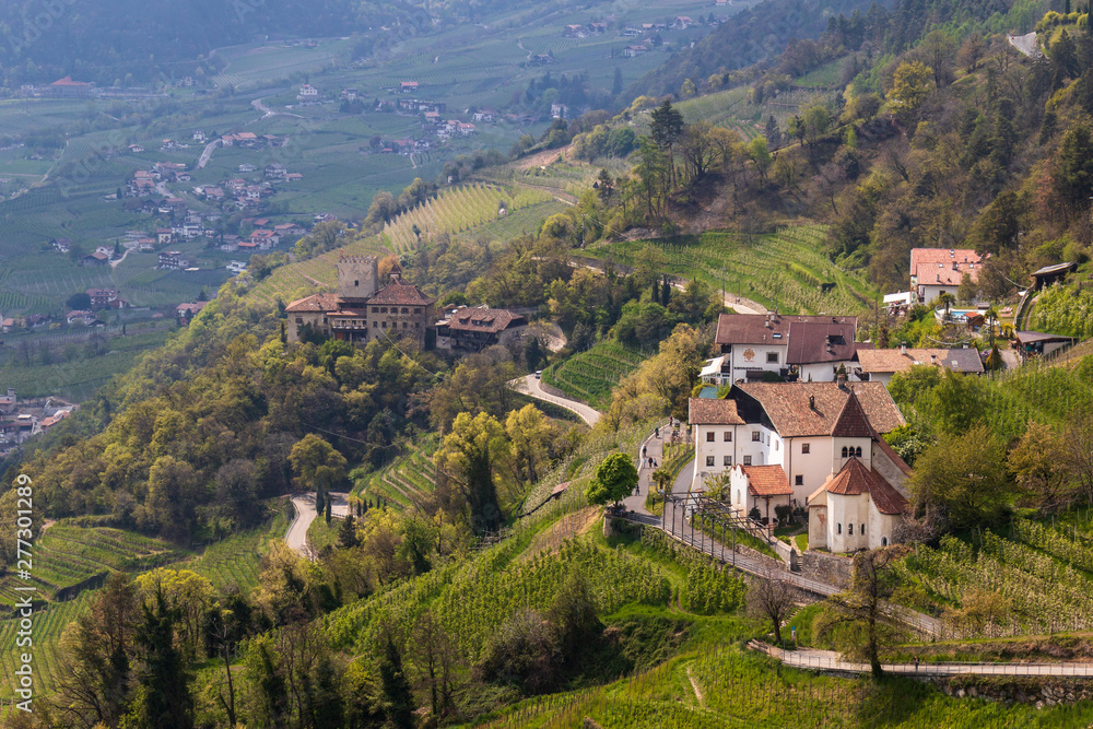 Panoramic view to Castle Thurnstein and Church Sankt Peter ob Gratsch, from municipality village of Tirol, South Tyrol, Italy. Europe.