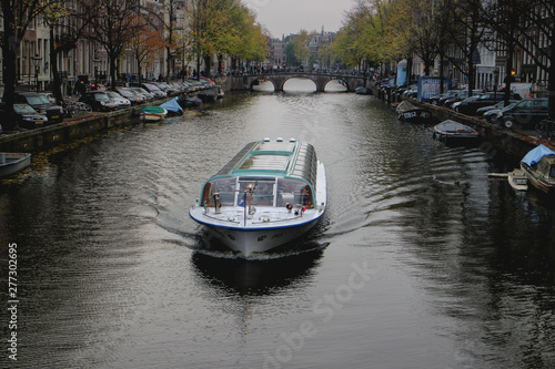 amsterdam boat slowly moving in the canals