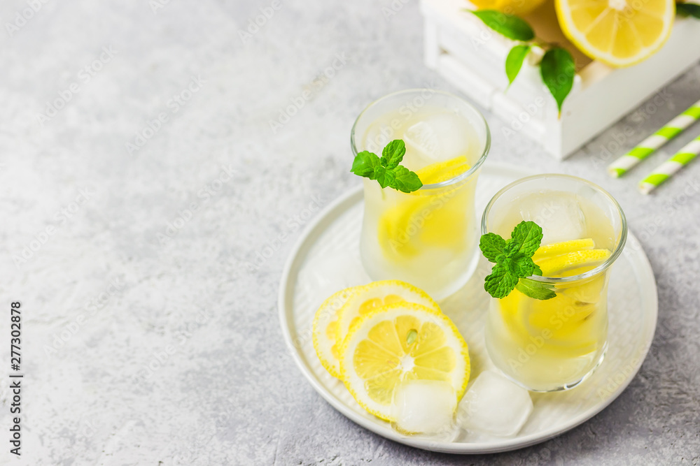Healthy honey and mint lemon iced detox water. Selective focus, space for text. Healthy honey and mint lemon iced detox water. Selective focus, space for text.