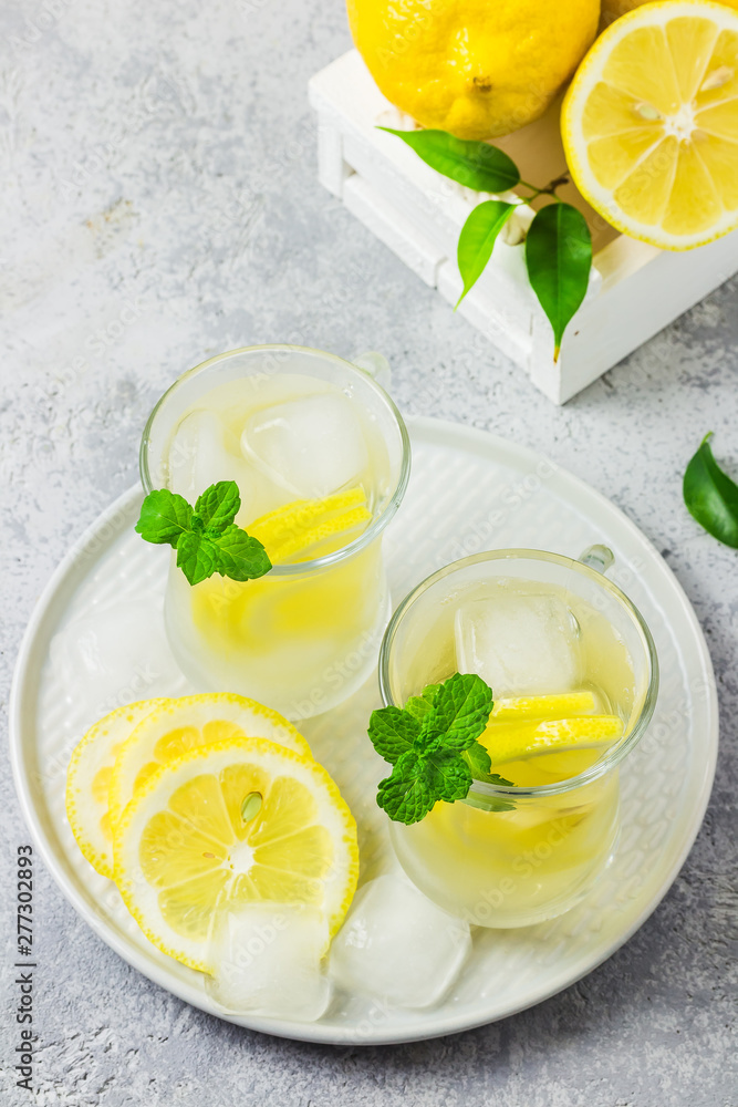 Healthy honey and mint lemon iced detox water. Selective focus, space for text. Healthy honey and mint lemon iced detox water. Selective focus, space for text.