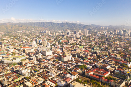 Cityscape in the morning. The streets and houses of the city of Cebu, Philippines, top view. Panorama of the city with houses and business centers.