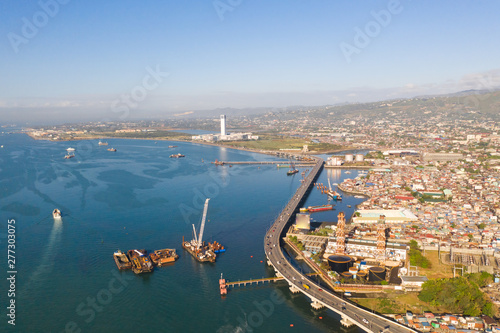 Panorama of Cebu in the morning. Road bridge and seaport, view from above. The coastal part of the city of Cebu, Philippines. photo