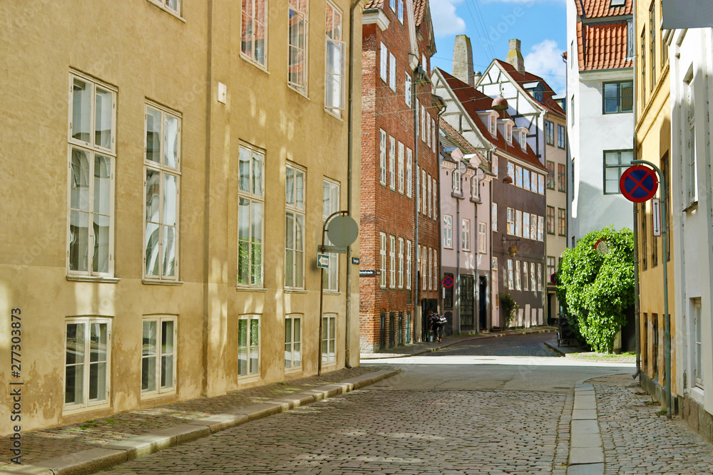 Street in old historic center of Copenhagen. Red tiled roofs. Denmark. Scandinavia.