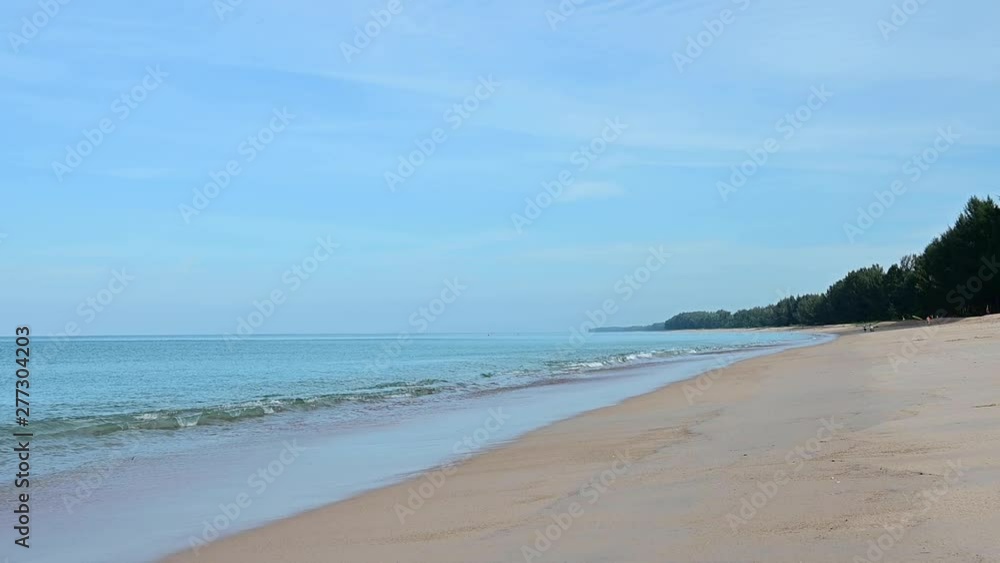 Slow motion shot of sea waves on sandy beach Slow motion shot of sea waves on sandy beach