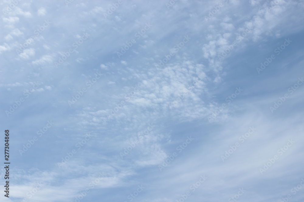 Beautiful feathery clouds in the blue sky Beautiful feathery clouds in the blue sky