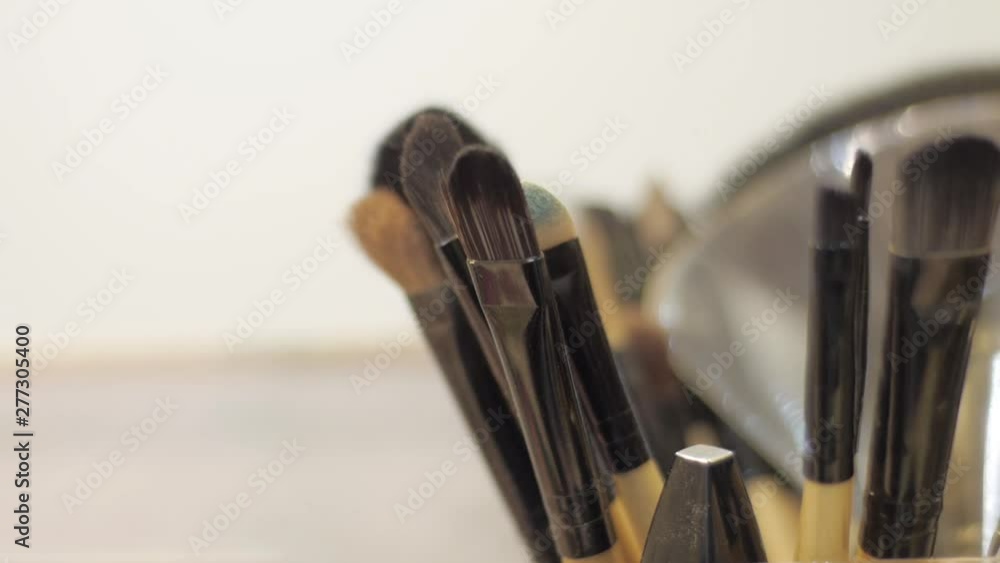 Close up of makeup brushes on table in beauty salon Close up of makeup brushes on table in beauty salon