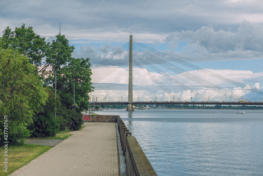 City Riga, Latvia Republic. Urban city cable bridge and river. Old metal constructions.  July 4. 2019