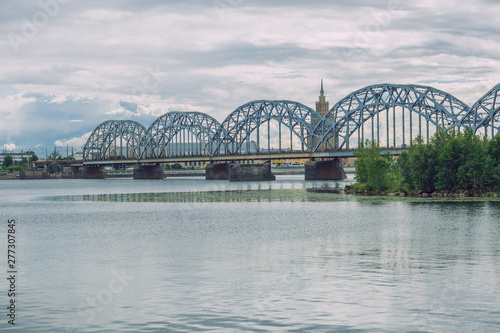 City Riga  Latvia Republic. City railway bridge and old constructions. July 4. 2019 Travel photo.