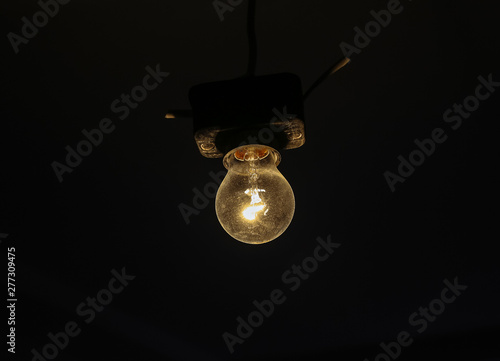 Wallpaper Mural Dimming light bulb in dark room. Renovation maintenance repair works indoor in the flat. Torontodigital.ca