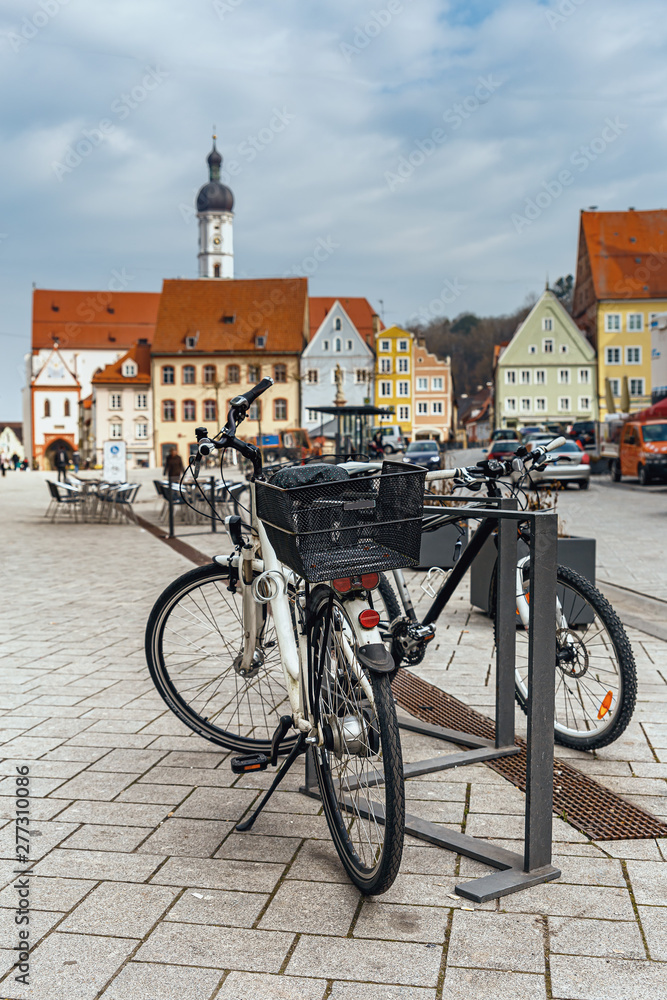 two bicycles in the parking lot in the historic center of the small German town of Landsberg am Lech
