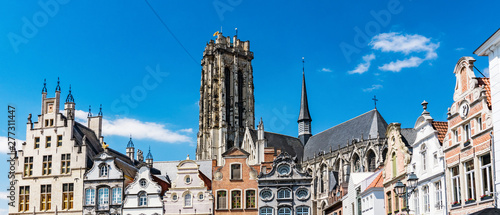 houses on sqaure called Grote Markt and tower of St. Rumbold's Cathedral  in Mechelen, Belgium photo