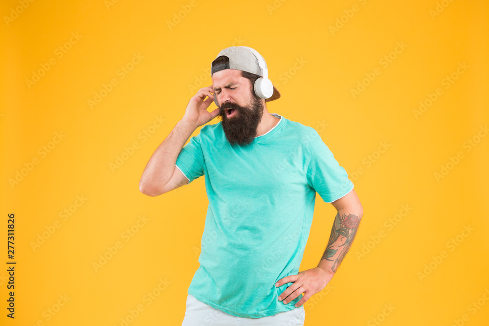 Bass low sound. Hipster headphones gadget. Inspiring song. Music library. Party every day. Rhythm of life. Bearded guy enjoy music. Lifestyle music fan. Man listening music wireless headphones