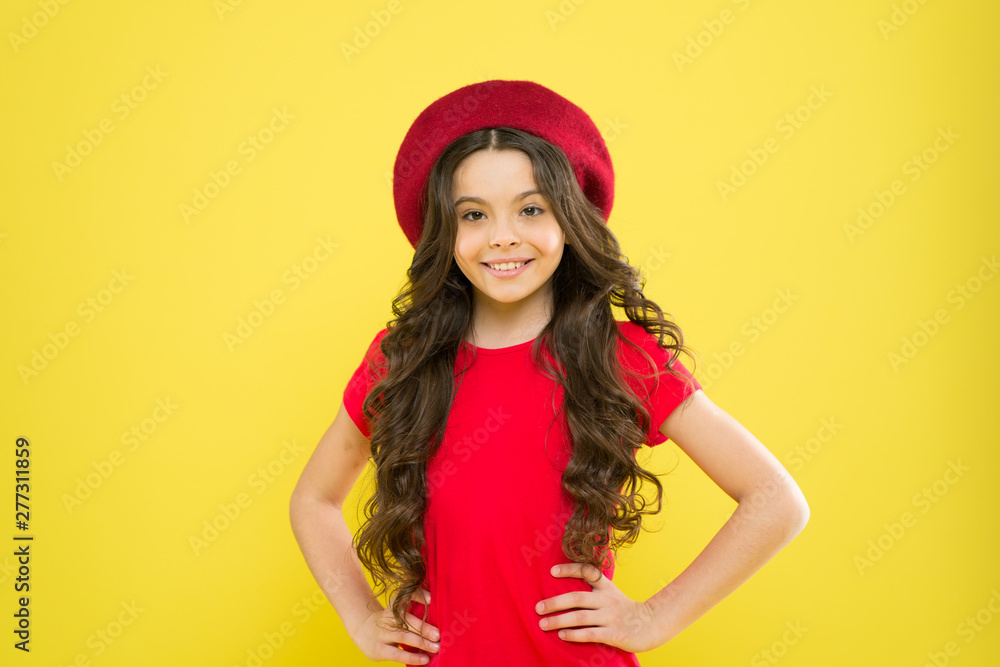 Ambitious and beautiful. summer fashion and beauty. childhood. hairdresser salon. happy girl with long curly hair in beret. parisian child on yellow background. little girl in french style hat Ambitious and beautiful. summer fashion and beauty. childhood. hairdresser salon. happy girl with long curly hair in beret. parisian child on yellow background. little girl in french style hat
