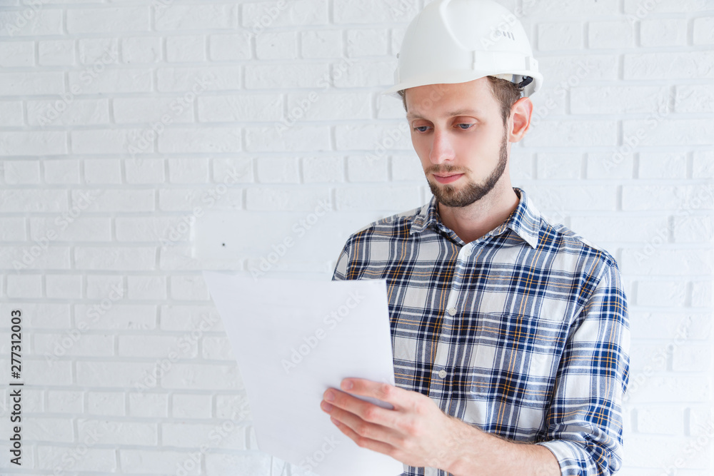 Construction renovation engineer reading documents Construction renovation engineer reading documents