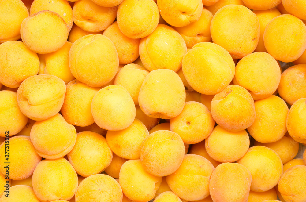 Ripe and delicious apricots background Ripe and delicious apricots background