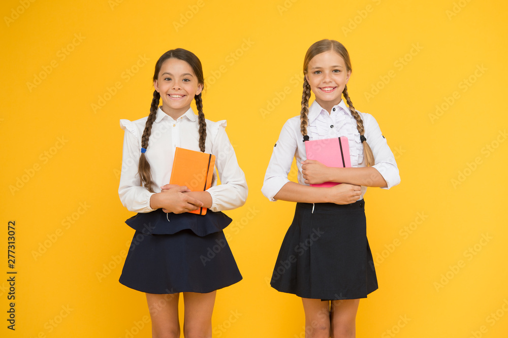 Education is step by step process of getting knowledge. Classmates having fun at school. Happy childhood. School education concept. Friends adorable pupils. Schoolgirls formal style school uniform Education is step by step process of getting knowledge. Classmates having fun at school. Happy childhood. School education concept. Friends adorable pupils. Schoolgirls formal style school uniform