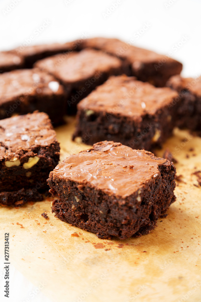 Homemade chocolate brownies on a baking sheet, side view. Close-up. Homemade chocolate brownies on a baking sheet, side view. Close-up.