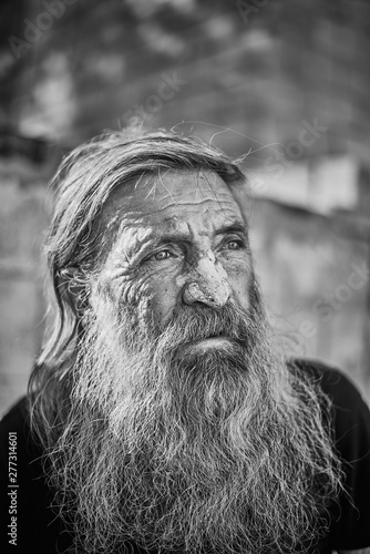 Close-up shot of an old homeless man's face