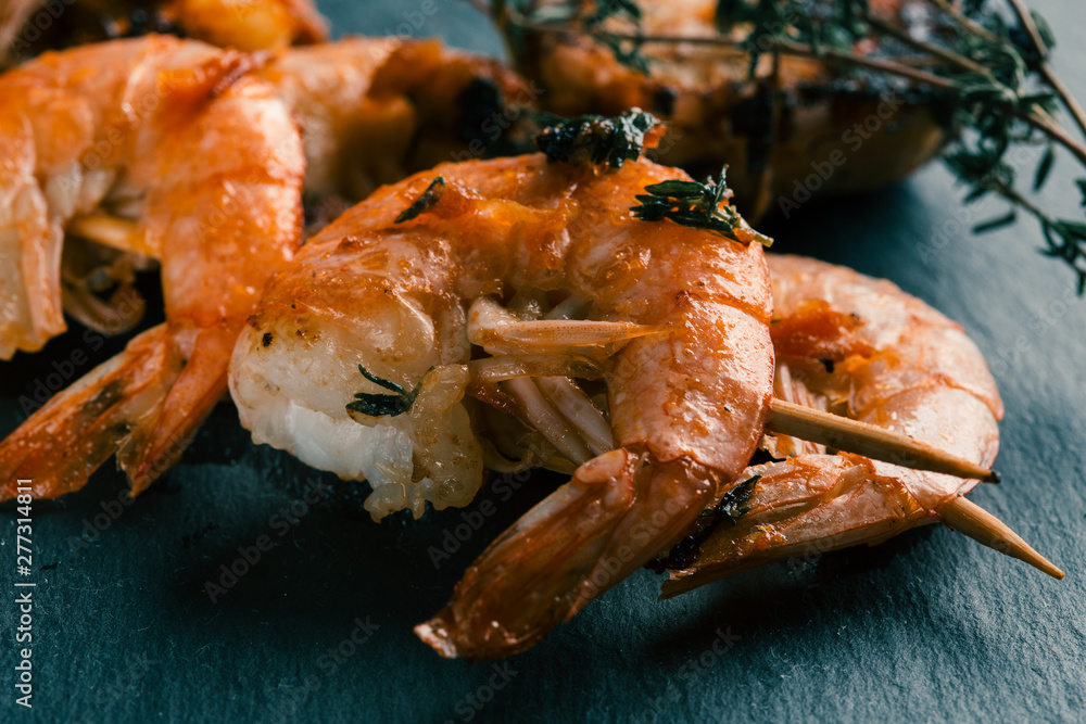 Hot fresh shrimp skewer with fried herbs Hot fresh shrimp skewer with fried herbs