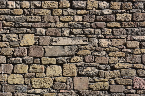 wall made of irregular reddish stones