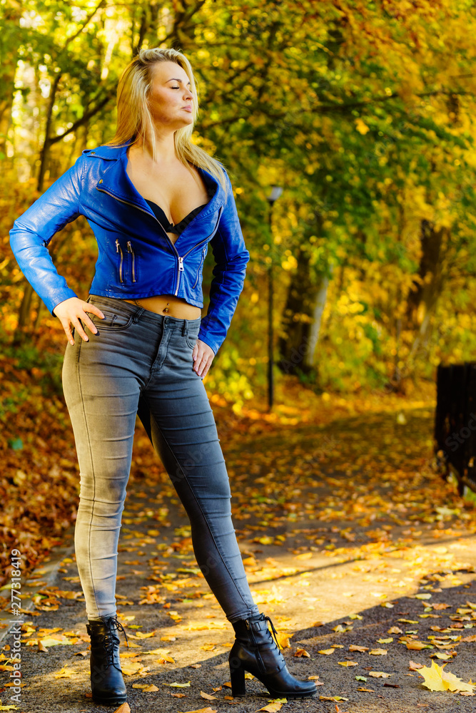 Fashion woman walking in autumn park Fashion woman walking in autumn park