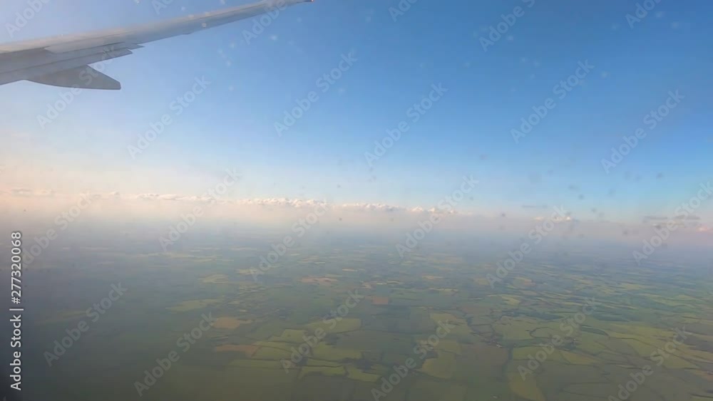 Flight Over England, United Kingdom. View From Airplane Porthole. Flight Over England, United Kingdom. View From Airplane Porthole.