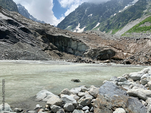 Russia, North Ossetia - Alania. Tsey glacier in summer in cloudy day photo