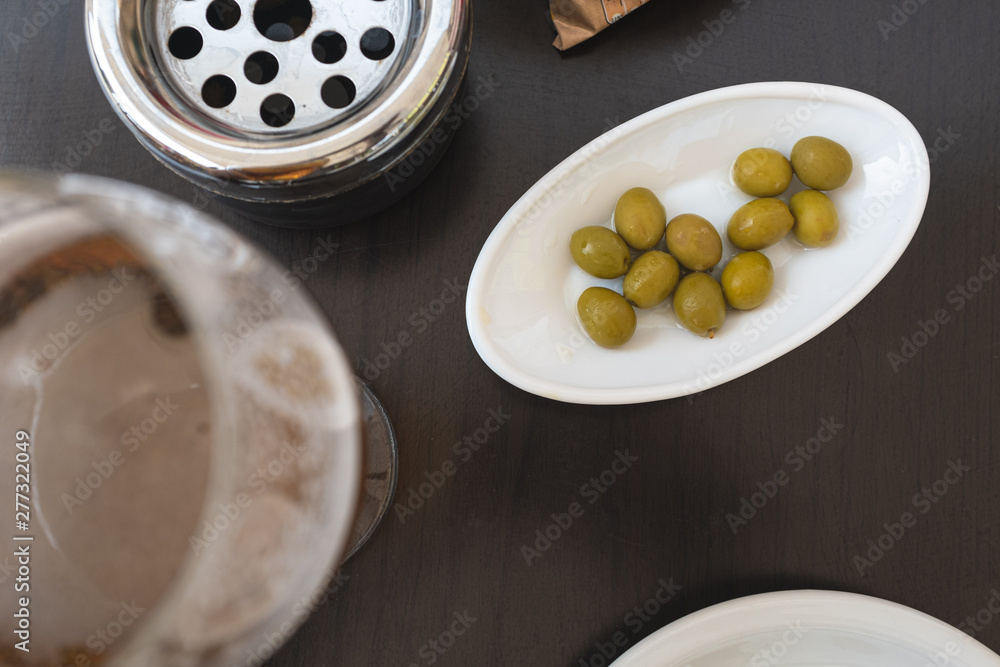 Green olives vermouth on a restaurant snack Green olives vermouth on a restaurant snack