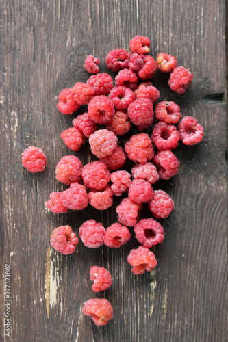 raspberries on wooden background