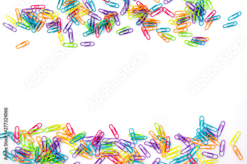 Colorful paper clips isolated on white background with copy space. Back to school concept
