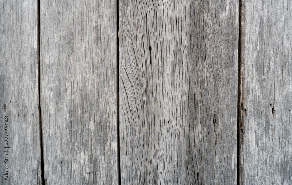 Old grey wood texture background. Wood plank abstract background. Empty weathered wooden wall. Surface of grey wood with nature pattern. Distressed and simplicity background. Vintage wooden floor.