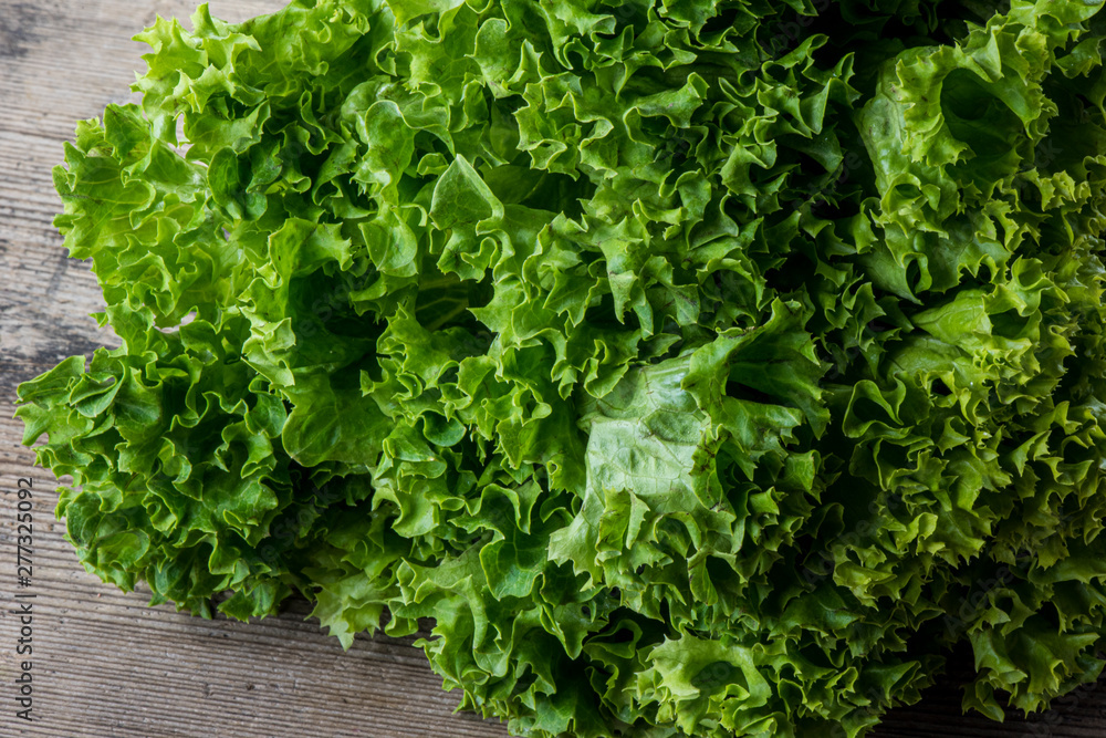 green salad on woodenbackground green salad on woodenbackground