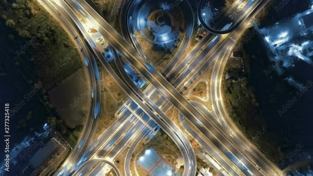 Hyperlapse timelapse of night city traffic on 4-way stop street intersection circle roundabout in bangkok at night, thailand. 4K UHD horizontal aerial view. Hyperlapse timelapse of night city traffic on 4-way stop street intersection circle roundabout in bangkok at night, thailand. 4K UHD horizontal aerial view.