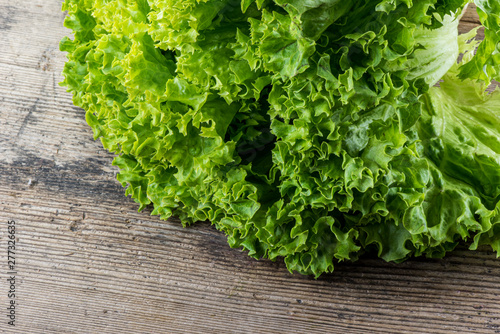 green salad on woodenbackground