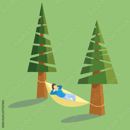 Man lying in a hammock hanging between tree