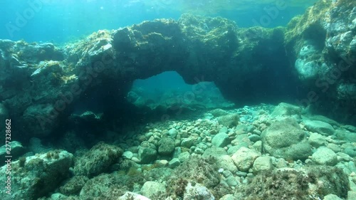 Natural arch in rock underwater in the Mediterranean sea, Spain, Costa Brava, Catalonia, Calella de Palafrugell photo