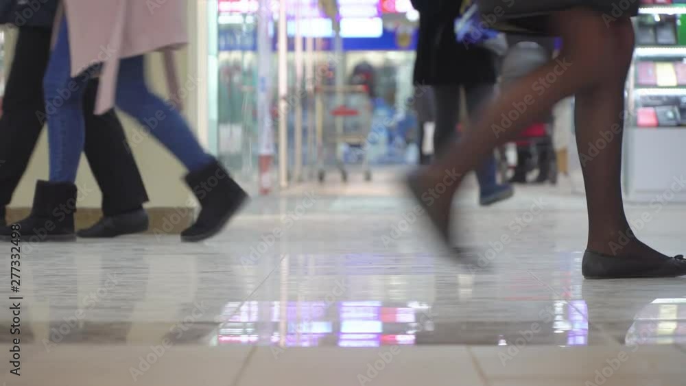 Legs of people walking in crowd. Close-up and shallow depth of field scene. Legs of people walking in crowd. Close-up and shallow depth of field scene.