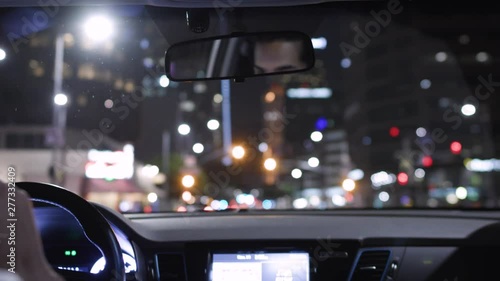 Interior SUV Man Driving late night Down Town   photo